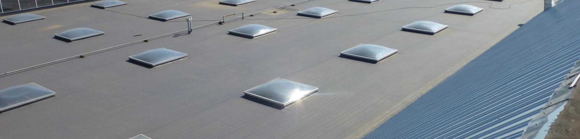 A commercial roof with skylights