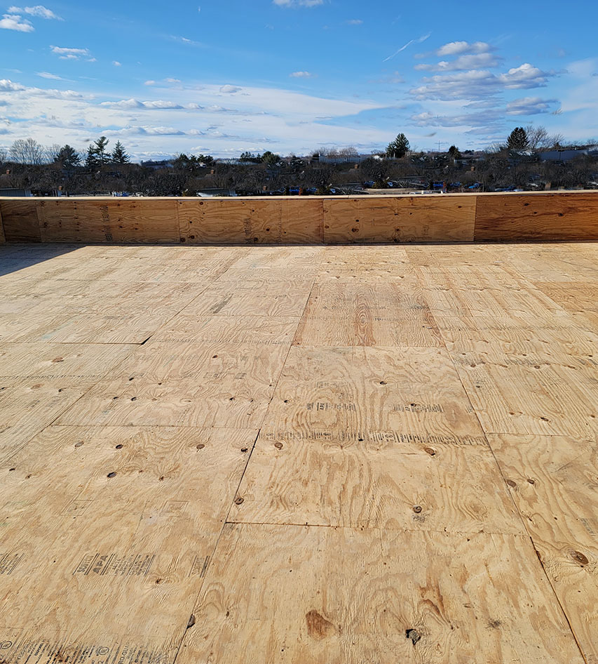 Roofing boards on a flat commercial roof in Worchester, MA.