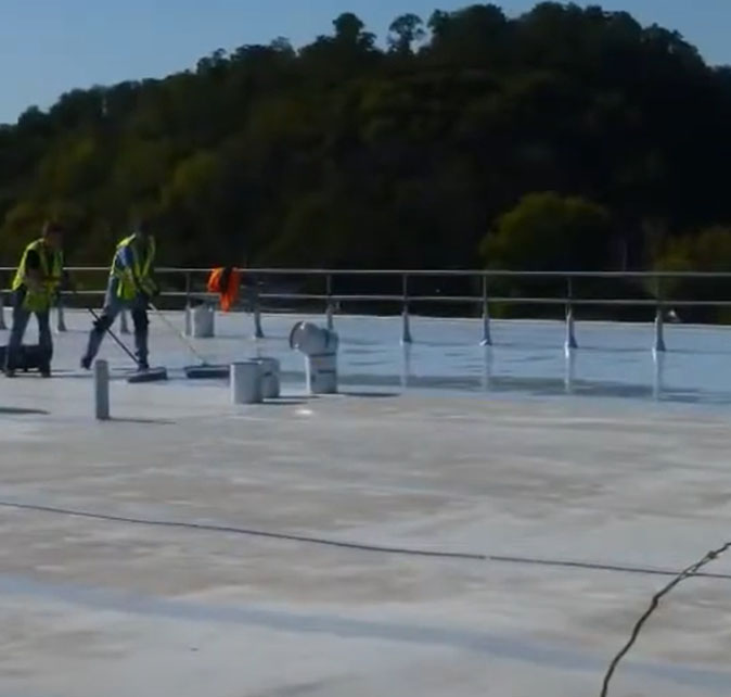 A Vanguard Roofing crew on a commercial building installing a new roof in Worchester, MA.