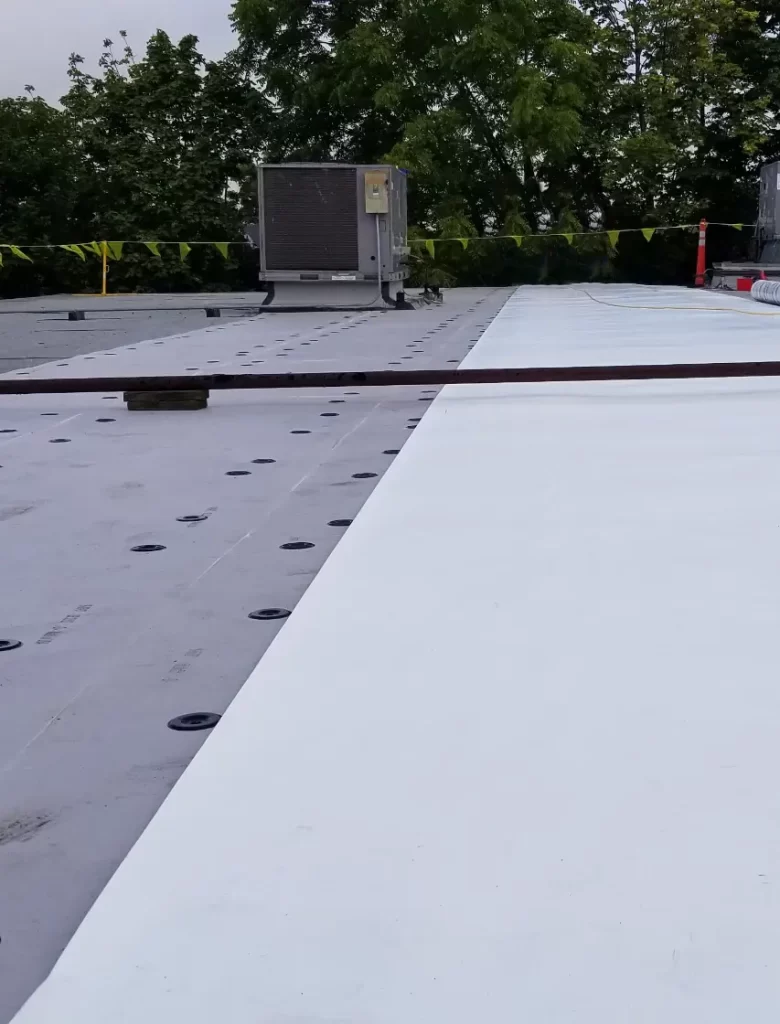 Rooftop view of a commercial flat roof being maintained by Vanguard Roofing