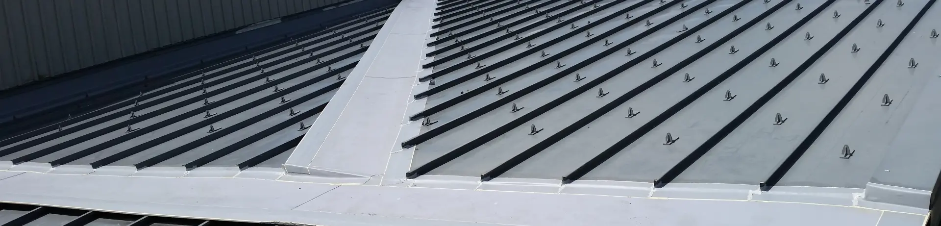 A closeup image of a commercial metal roof.