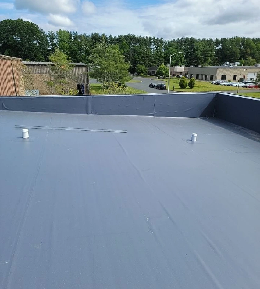A flat commercial roof in Pittsfield, CT after repair by Vanguard Roofing.