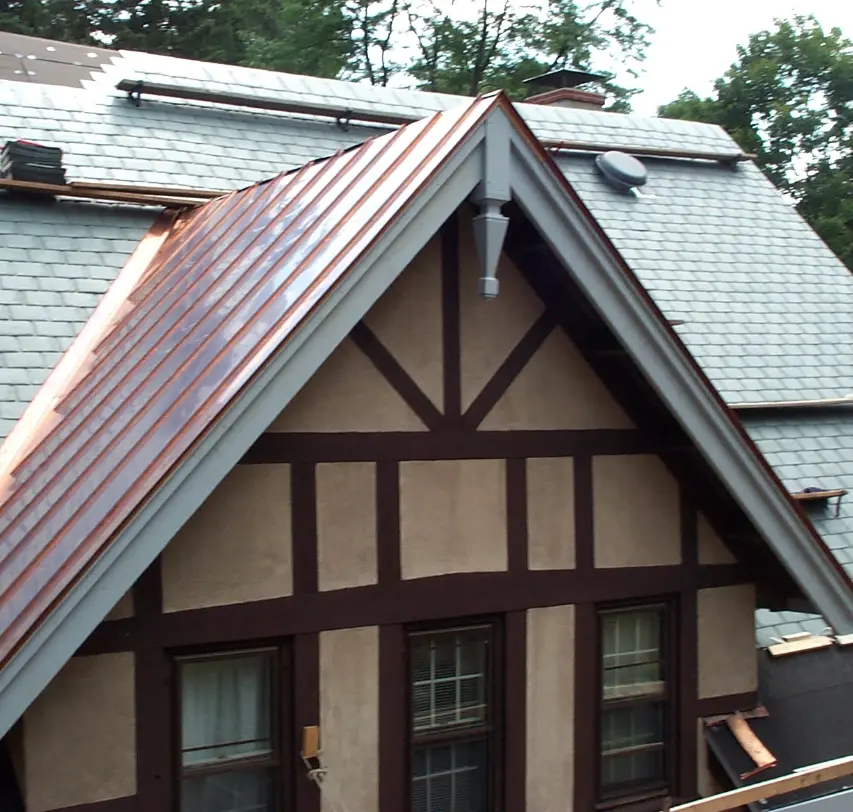 A slate roof being installed on a building by Vanguard Roofing.