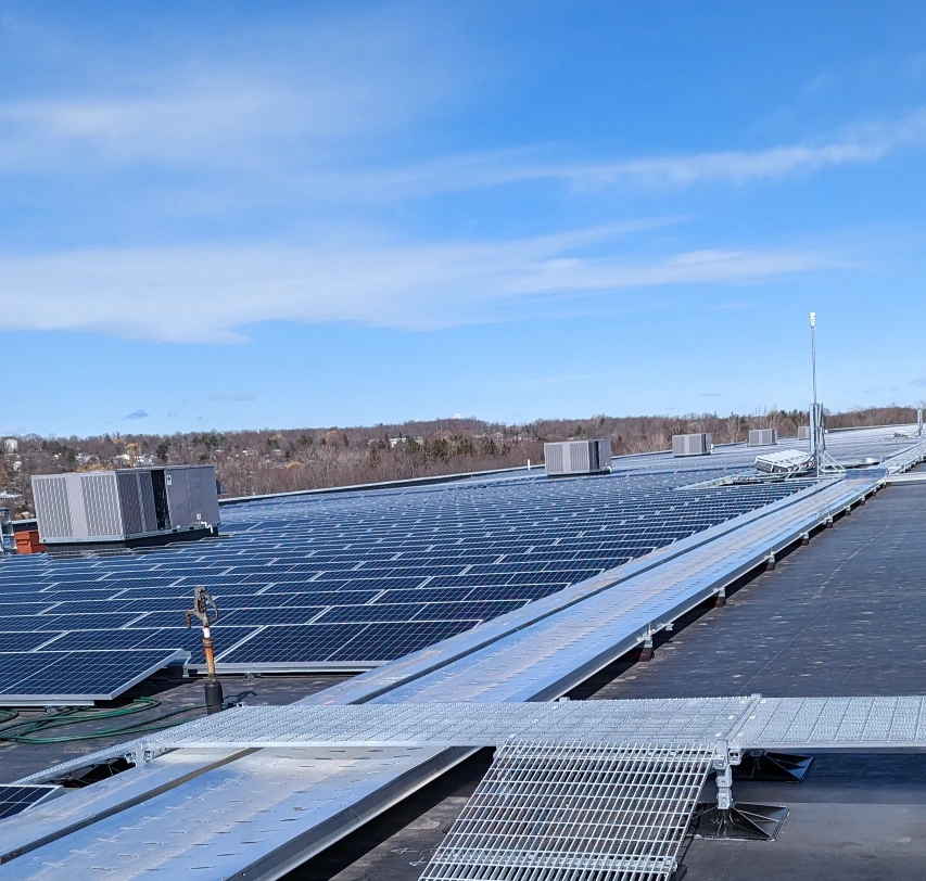 A large array of solar panels installed by Vanguard Roofing.