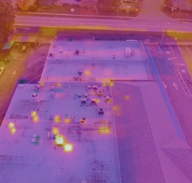 A thermal image on a commercial  roof showing potential areas of damage.