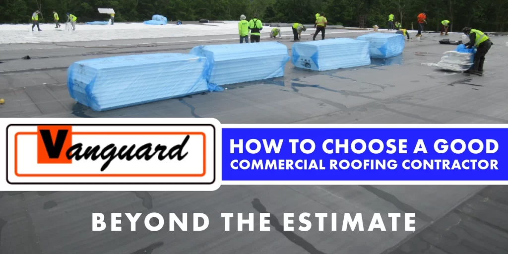Commercial roofing crew in high-visibility safety vests installing roofing materials on a large flat commercial roof with blue-wrapped insulation materials