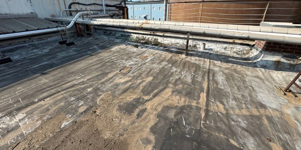 Commercial roof showing surface wear and deterioration from weather exposure