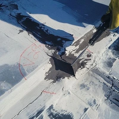 Close-up of crack in commercial roof membrane.