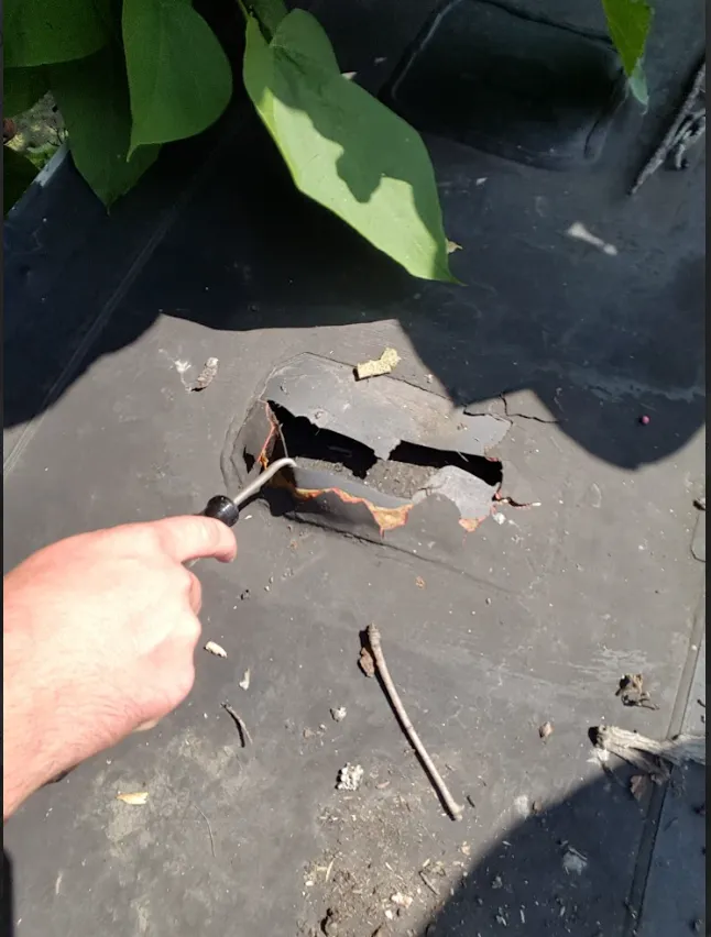 damaged flat roof  causing roof leaks in Wappingers falls